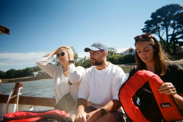 Three friends on a boat, shot on CATCH film