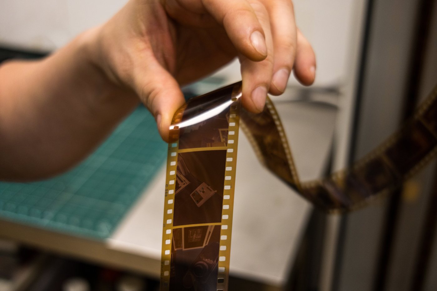 Checking a developed strip of negatives on the lightbox