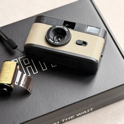 The CATCH camera and film on the box